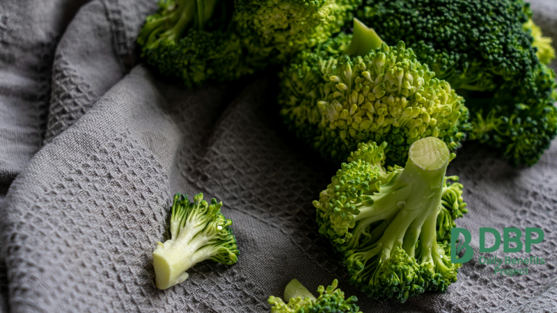 Raw Broccoli Florets on Towel Fresh broccoli florets laid out on a textured grey towel