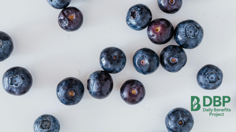 Scattered Blueberries on White Background Close-up of blueberries scattered on a white surface