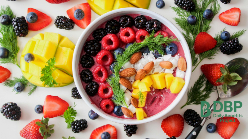 Colorful Berry and Nut Smoothie Bowl Smoothie bowl with blueberries, strawberries, raspberries, mango, and almonds