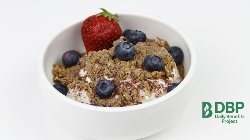 Blueberry Yogurt Dessert Bowl of yogurt topped with granola, blueberries, and a strawberry