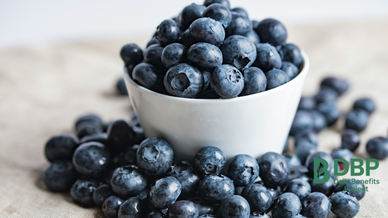 Blueberries Overflowing White bowl overflowing with fresh blueberries on linen fabric