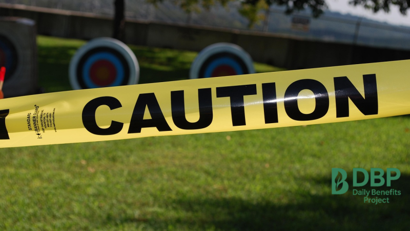 Yellow caution tape on a green field