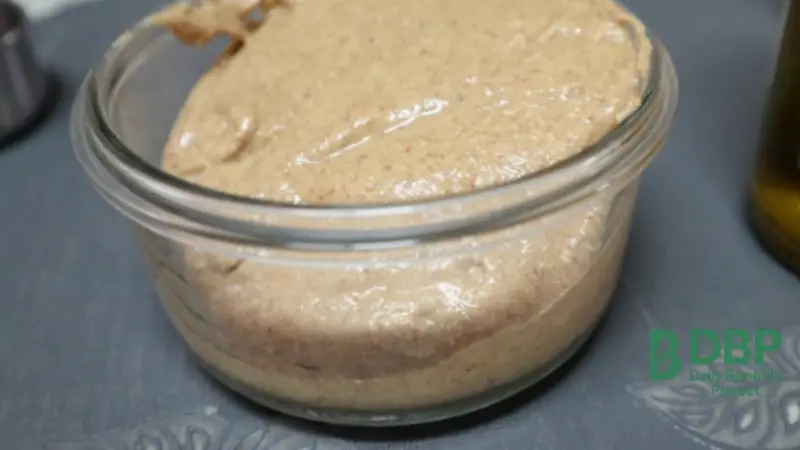 almond butter in a glass jar packed with magnesium and healthy fats