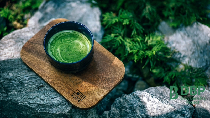 Cup of green matcha tea in a peaceful garden setting Green tea with EGCG antioxidants helps boost immune function