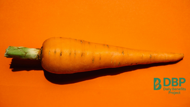 Fresh orange carrot on vibrant background Carrots are rich in beta carotene for mucous membrane health